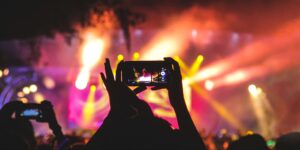 Concertgoer holding cell phone